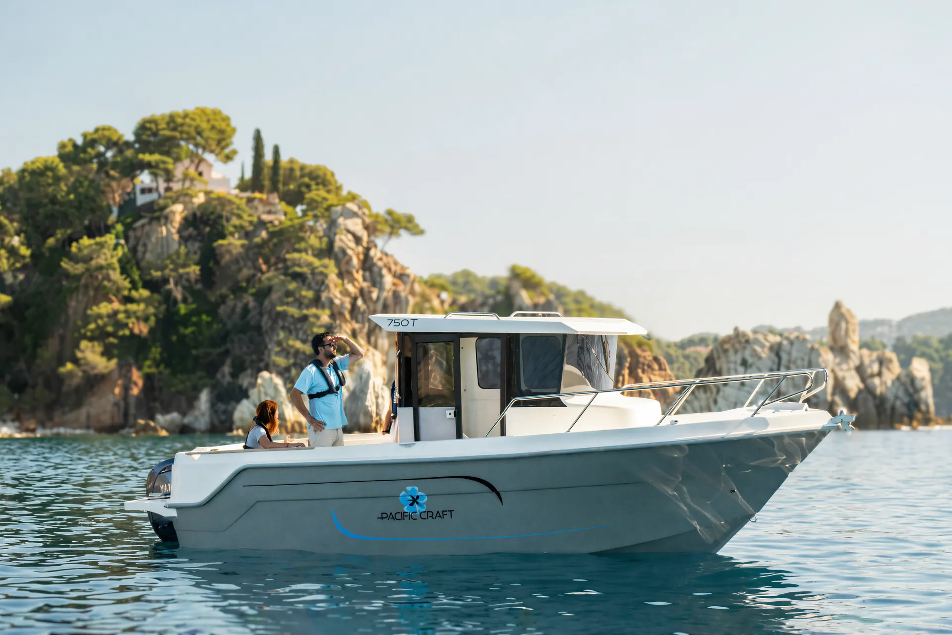 Pacific Craft 750 Timonier at anchor beside an islet